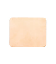 The Bed|Stü Launcher Mouse Pad is a rectangular, blank, light tan leather accessory with rounded corners—shown on a white background—making it the perfect sophisticated addition to any office or workspace.