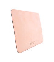 Light tan Launcher Mouse Pad crafted from leather, featuring rounded corners and the Bed|Stü logo embossed near the bottom right corner, this elegant workspace accessory is displayed against a white background.