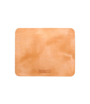The Launcher Mouse Pad by Bed|Stü is a rectangular tan leather desk pad with rounded corners, displayed on a white background. This refined workspace accessory showcases a smooth leather texture and a subtle embossed Bed|Stü logo near one edge, making it perfect for use as a mouse pad or to enhance your desktop organization.