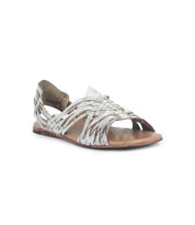 The Lauren II by Bed|Stü is a single silver hand-woven leather sandal featuring an open toe and flat sole, displayed on a white background.
