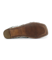 The image shows the bottom view of a worn Bed|Stü Lauren II hand-woven leather huarache sandal, featuring a textured rubber sole and a rectangular heel section.