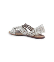 The Bed|Stü Lauren II woven leather huarache sandal, featuring a supportive back heel, is shown angled against a white background. This handcrafted footwear displays signs of wear, including creasing and discoloration.
