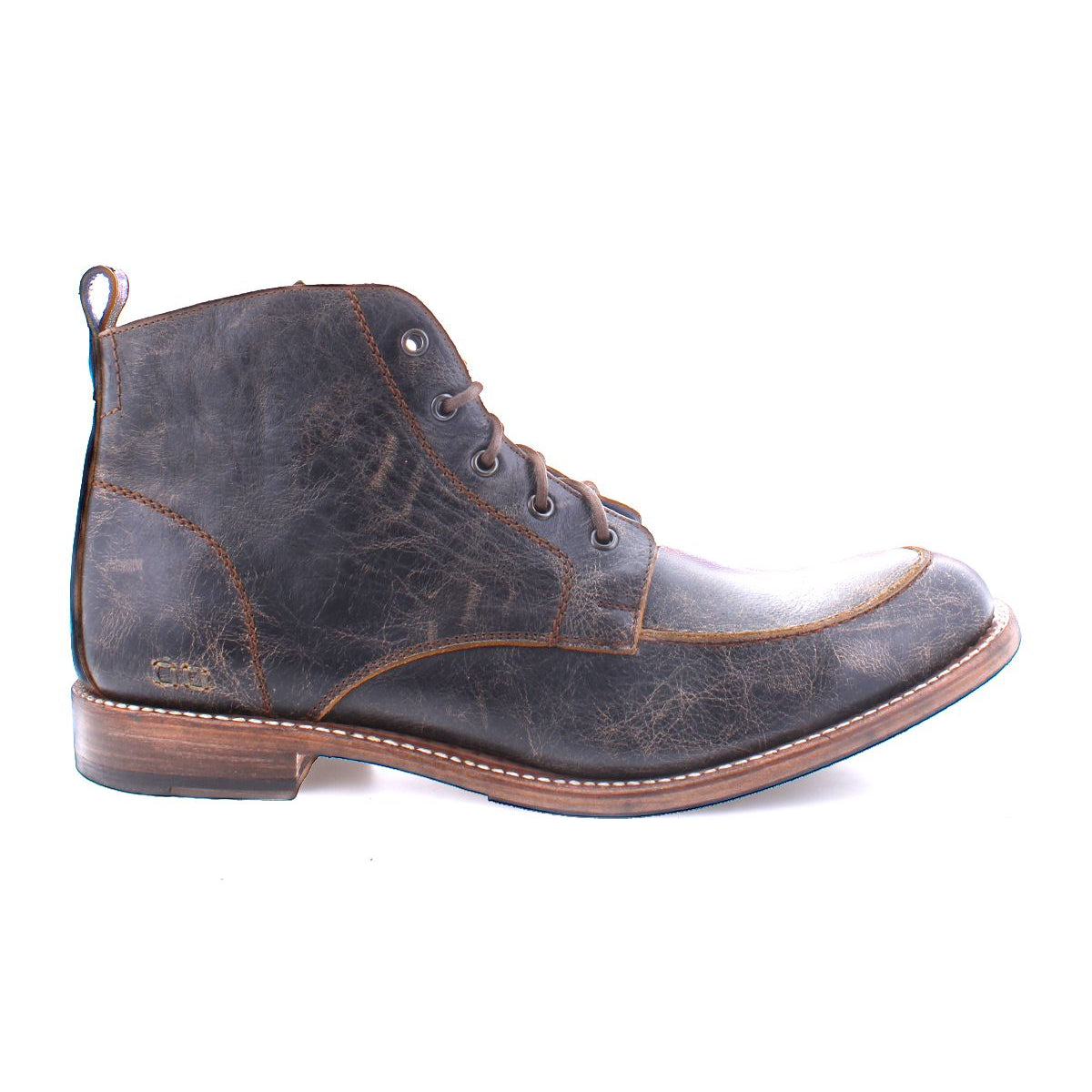 The Bed|Stü Lincoln II is a brown leather lace-up work-boot featuring an apron toe, visible creases, a low stacked heel, and a pull tab at the back, displayed in a left side profile against a white background.