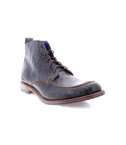 A single Lincoln II work boot by Bed|Stü, crafted from dark brown leather with an apron toe, visible stitching, low heel, and a slightly worn finish, is displayed on a white background.