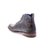 A single Lincoln II men’s work-boot by Bed|Stü, crafted from dark brown leather with an apron toe and a worn finish, is shown from the back-left side against a white background.