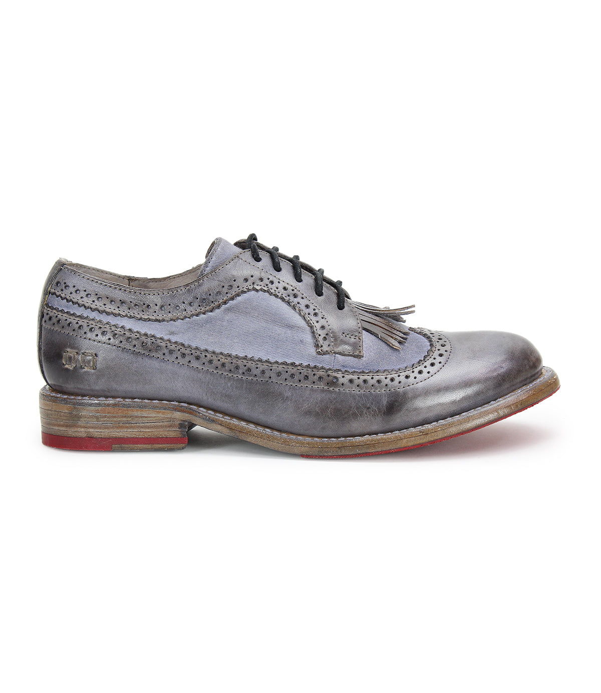 Gray leather Wingtip Toe oxford shoe by Bed|Stü, model Lita K, featuring black laces, elegant brogue details, and a low wooden sole with a red accent on the heel, shown in profile on a white background.