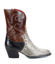 A side view of the Bed|Stü Locate Western boot, featuring a brown upper, gray midsection, black heel, and decorative flame stitching.