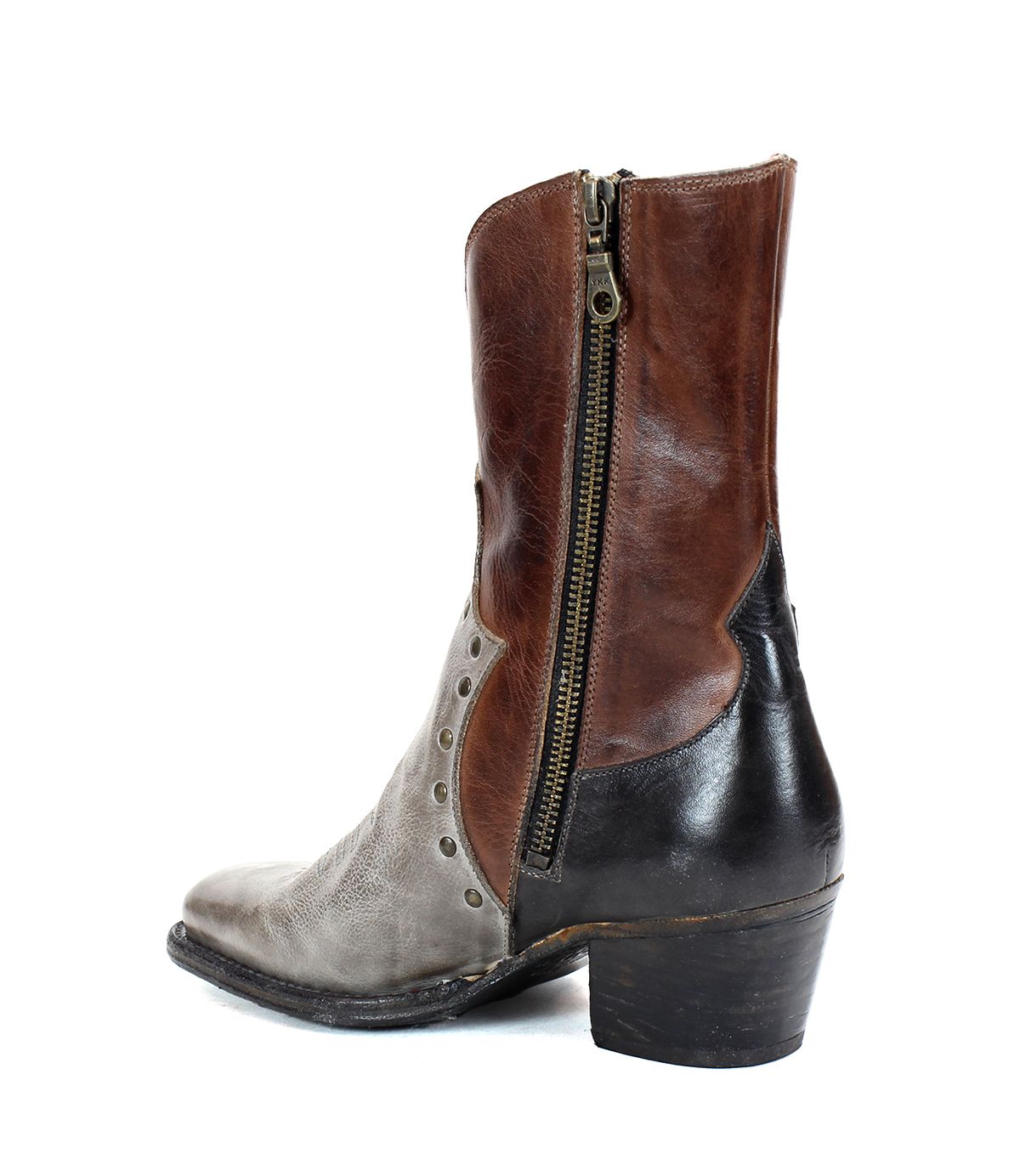 The Bed|Stü Locate is a mid-calf leather Western boot featuring brown, black, and gray panels, distinctive flame stitching, a side zipper, decorative studs, a pointed toe, and a low heel.