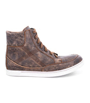 The Bed|Stü Lordmind is a brown high-top sneaker featuring a worn leather finish, classic lace-up design with brown laces, and a white rubber sole. Shown from the side against a white background, this timeless leather shoe is perfect for those seeking cushioned footwear.