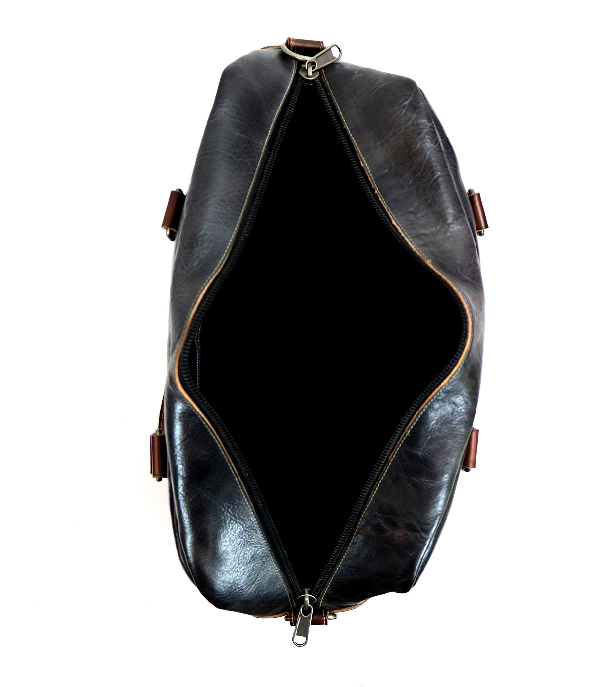 Top view of an open, empty Bed|Stü Luke travel bag crafted from black vegetable tanned leather, featuring a visible zipper and brown strap accents, displayed on a white background.