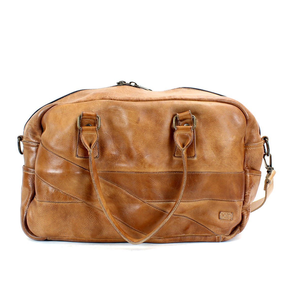 The Luke by Bed|Stü is an oversized tan leather duffle bag made from vegetable-tanned leather, featuring double handles, an adjustable shoulder strap, and a zippered top closure, shown against a white background.