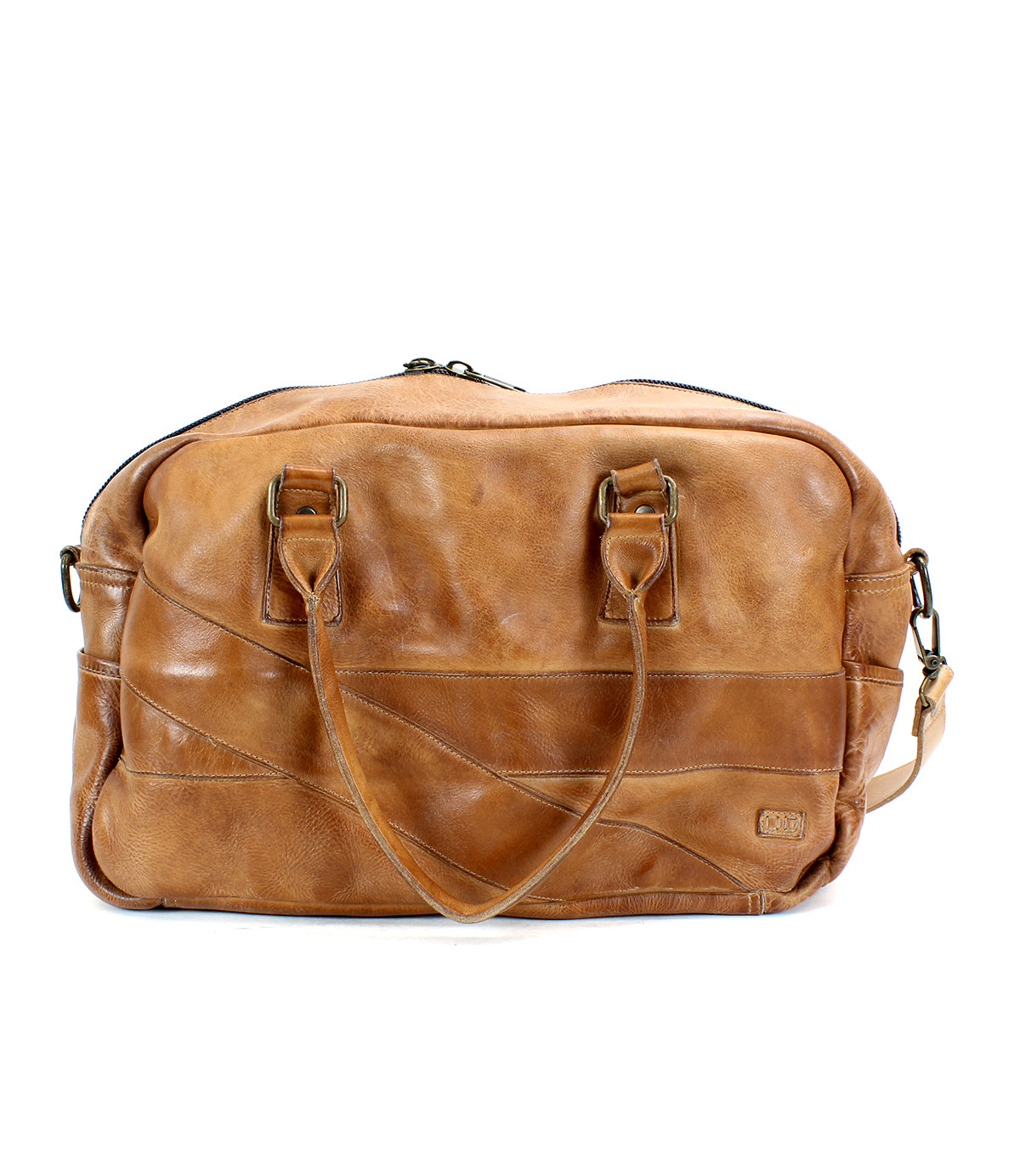 The Luke by Bed|Stü is an oversized tan leather duffle bag made from vegetable-tanned leather, featuring double handles, an adjustable shoulder strap, and a zippered top closure, shown against a white background.