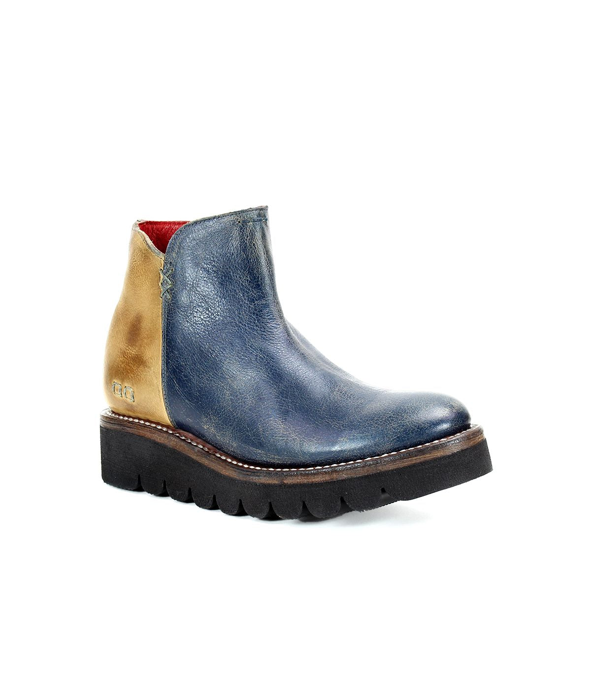 The Bed|Stü Lydyi is a single leather ankle boot featuring a blue leather front, tan leather heel, red inner lining, white stitching, and a thick black ridged platform outsole.