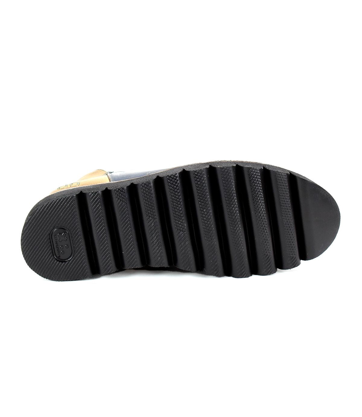 The image shows the bottom view of the Bed|Stü Lydyi shoe, featuring a black sole with deep, horizontal ridges and a textured heel area—details that suggest this is a leather ankle boot with a sturdy platform outsole.