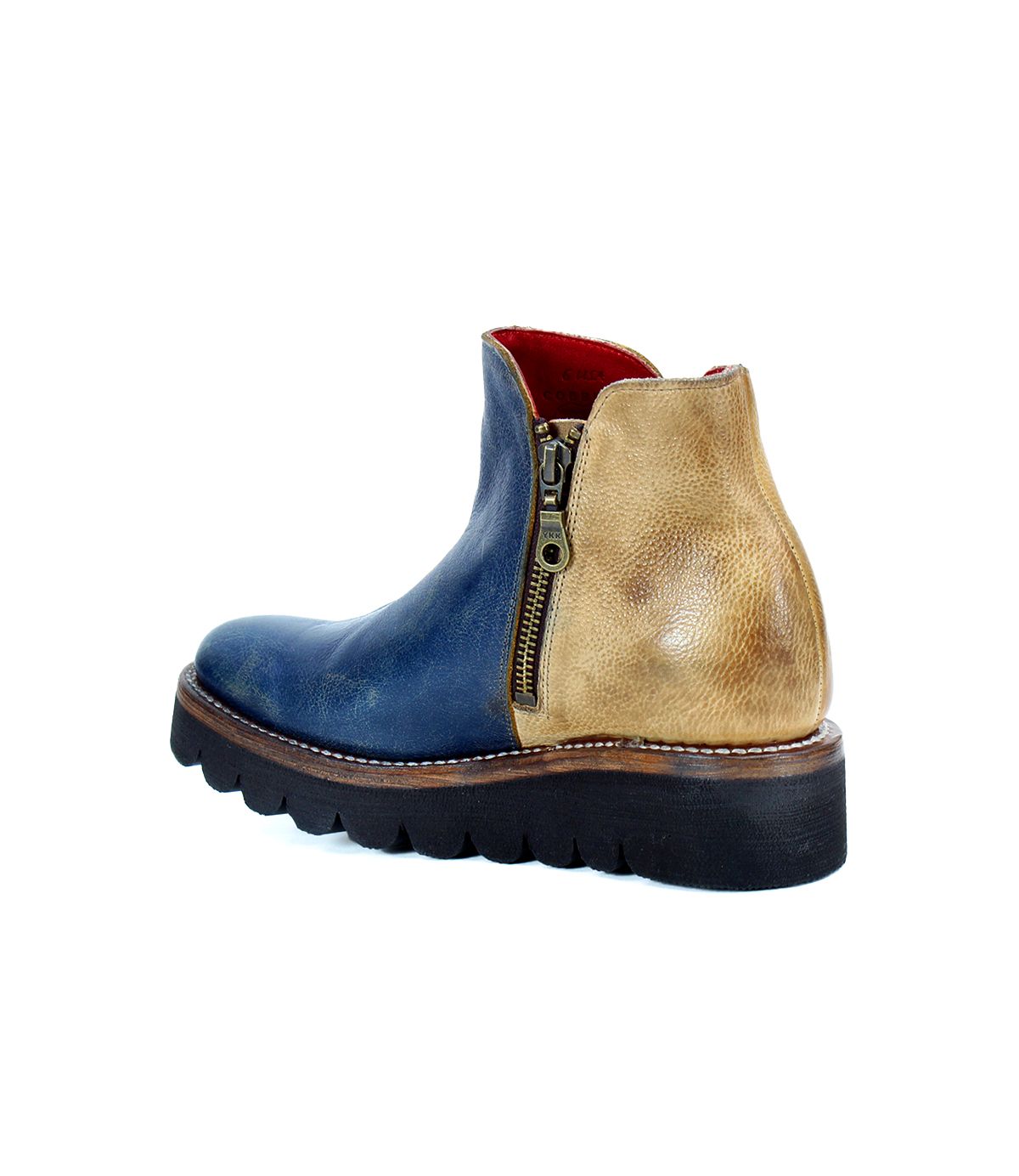 The Bed|Stü Lydyi is a blue and tan leather ankle boot featuring a side zipper, black ridged platform outsole, cushioned insole, and visible stitching, shown against a white background.
