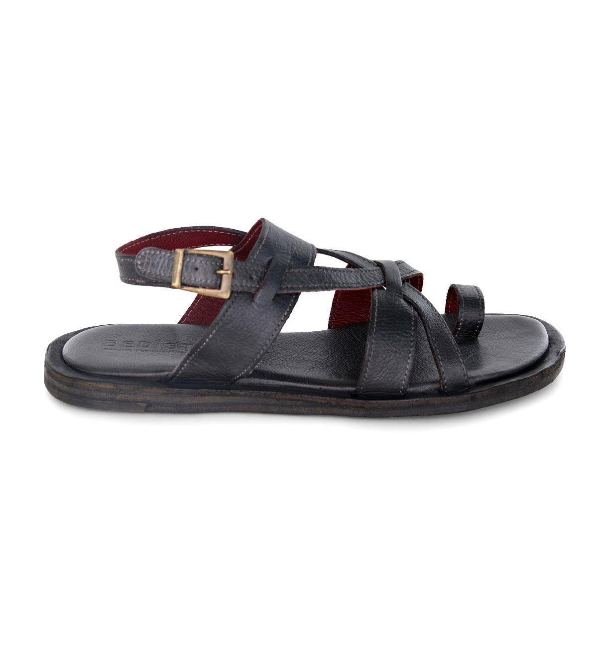 Introducing the Manati II sandal by Bed|Stü: a handcrafted black leather sandal featuring multiple straps, an open toe, a buckle closure, and a flat sole for a barefoot feel, displayed from the side against a white background.