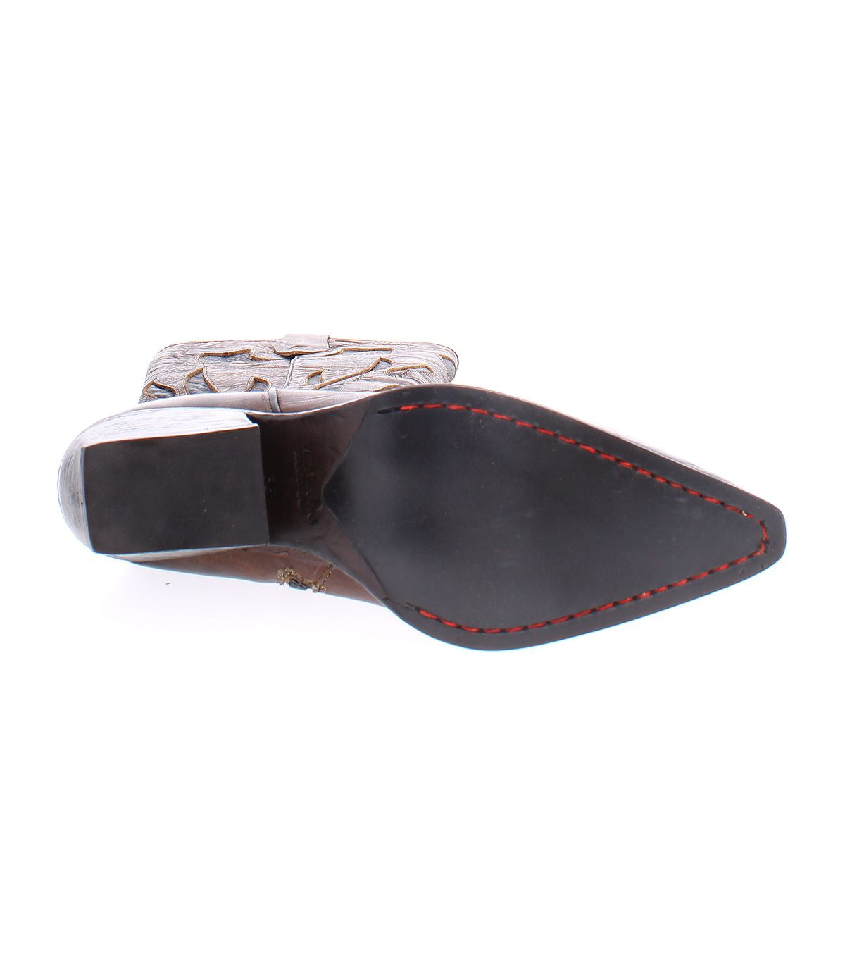 Bottom view of the Bed|Stü Meadow pointed-toe cowgirl boot with a black sole, red stitching around the edge, and a stacked heel—showcasing the fine craftsmanship found in this quality leather style.