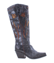 The Bed|Stü Meadow is a tall black leather cowgirl boot featuring brown flame-like patterns, a pointed toe, and an angled heel, shown in profile against a white background. This striking style seamlessly blends classic Western flair with the superior craftsmanship of handcrafted Italian boots.