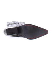 The Bed|Stü Meadow is a black pointed-toe leather shoe, shown from the sole with distinctive red stitching along the edge and a patterned heel—showcasing craftsmanship inspired by handcrafted Italian boots and timeless cowgirl boot design.