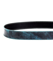 A close-up of the Bed|Stü Meander belt, featuring distressed black and blue leather with white edge stitching, looped in an oval shape.