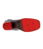 Bed|Stü "Merryli" dress shoe with a red sole and leather heel, reminiscent of classic hand-stitched boots. The sole is stamped with the brand "Bed|Stü" and the size. The shoe is photographed from the bottom.