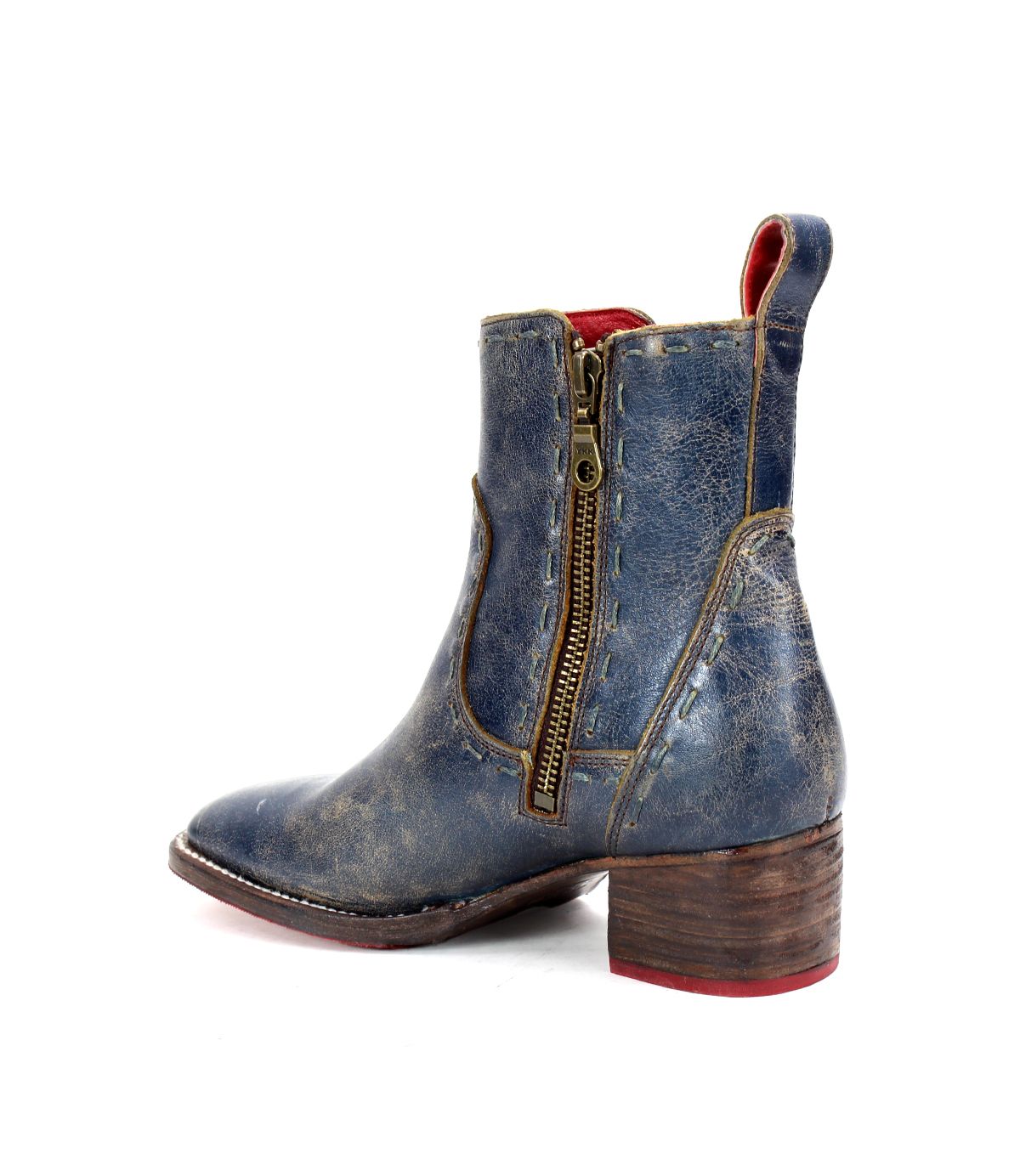 Side view of the Bed|Stü Merryli worn blue leather ankle boot, featuring a brown wooden heel, visible hand-stitched details, and a brass side zipper, shown against a white background.