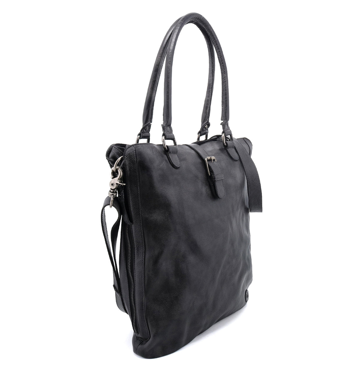 Bed|Stü's Mildred tote in black leather, featuring dual handles, an adjustable strap, silver hardware, and a side zipper with a secure zip-top closure—shown against a white background.