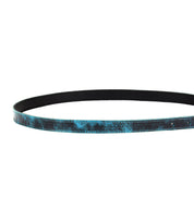 Introducing the Monae by Bed|Stü—a slim, flat black leather belt boasting a distressed blue texture along the outer surface, finished with a timeless buckle and photographed against a white background.