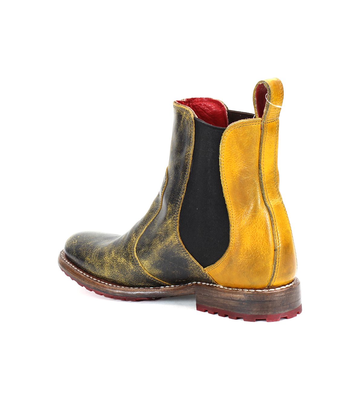 Introducing the Nandi by Bed|Stü—a single Chelsea boot crafted with a slip-on design, showcasing distressed yellow and black leather, black elastic side panels, a brown sole, and a striking red interior lining for exceptional versatility.