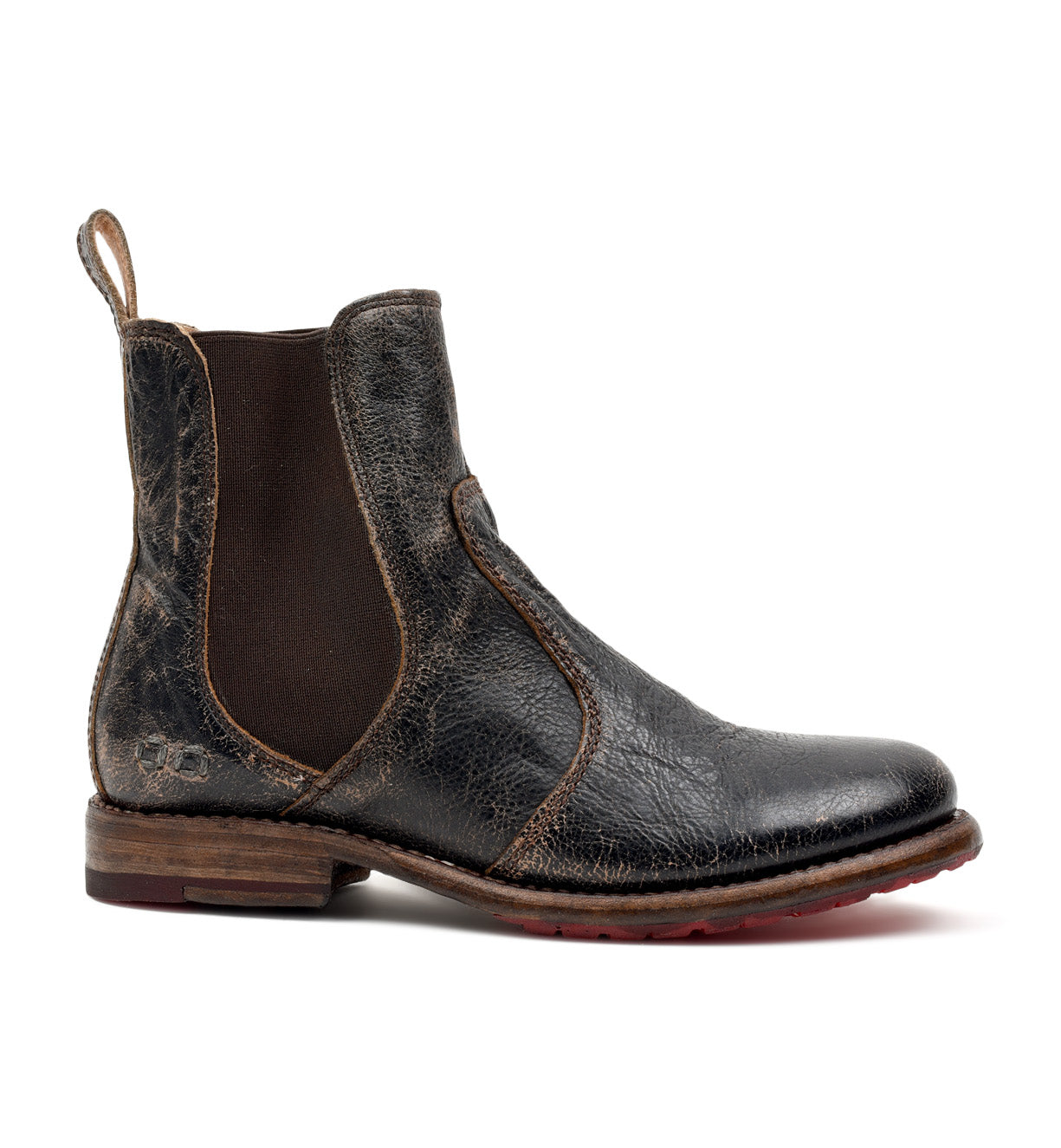 The Bed|Stü Nandi is a single worn black leather Chelsea boot with brown elastic side panels and a pull tab at the back, featuring a classic slip-on design, shown in profile on a white background.
