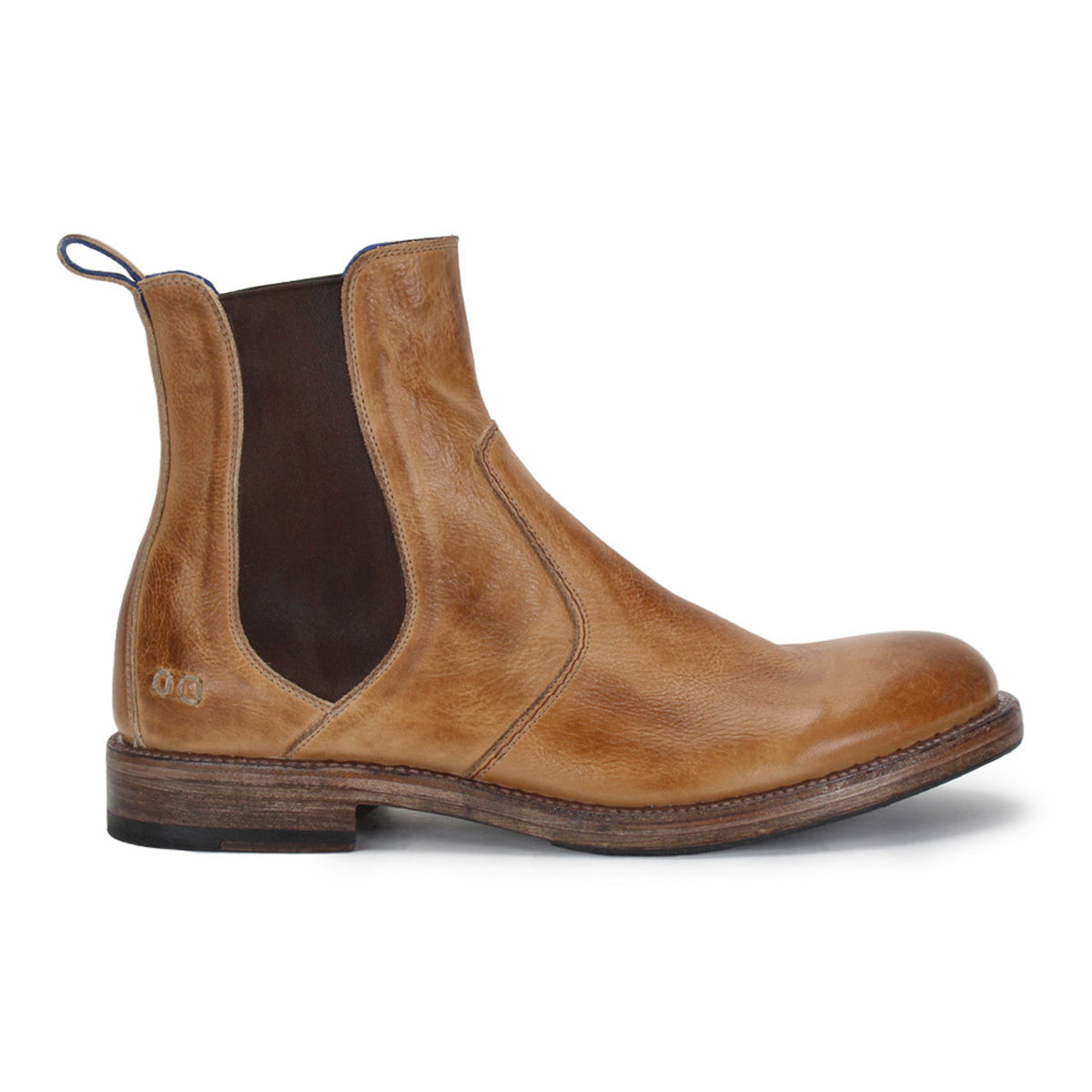 The Bed|Stü Nando is a tan hand-worked leather Chelsea boot featuring dark elastic side panels, a pull tab at the heel, and a low stacked heel, shown from the side on a white background.