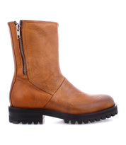 The Ploy ankle boot by Bed|Stü is crafted from brown Italian leather, featuring dual side zippers and a black rubber lug sole, displayed in a left side profile against a white background.