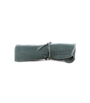 This stylish Prepped Leather Wrap by Bed|Stü is a rolled-up green leather pouch with white stitching and a tie closure, making it an ideal organizer for artists. The brand name "Bed|Stü" is printed on the side.