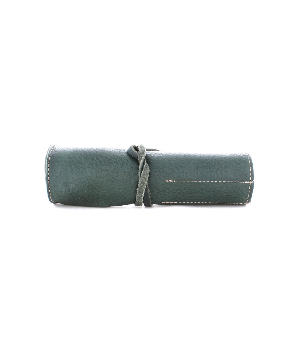 The Bed|Stü Prepped Leather Wrap, a green leather organizer pouch secured with a matching leather strap, is displayed against a plain white background.