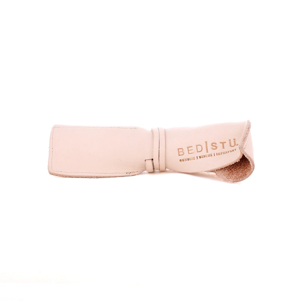 A light beige Prepped Leather Wrap eyeglass case by Bed|Stü, featuring a leather wrap design and "BED|STU GENUINE UNIQUE IMPERFECT" printed on the flap. Displayed against a plain white background, this stylish organizer is perfect for artists and creatives alike.