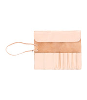 The Bed|Stü Prepped Leather Wrap is a light tan organizer featuring five narrow pockets, an open flap, and a slim leather tie on the left—perfect for artists who value both style and function.