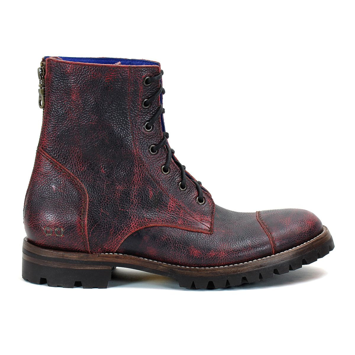The Bed|Stü Protege Trek is a single dark red leather combat boot featuring a textured finish, thick treaded sole, visible back zipper, and crafted with a Goodyear welt for added durability.