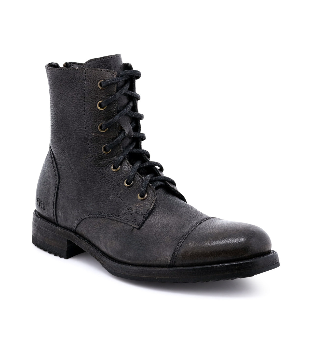 The Bed|Stü Protege is a single black leather lace-up combat boot with a low heel, round toe, and metal eyelets, featuring a durable Goodyear welt construction, photographed against a white background.