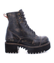 The Bed|Stü Prudence Hi is a single black leather combat boot featuring a chunky treaded sole and a distressed, worn finish, shown in side profile—ideal for those looking for edgy boots with rugged character.