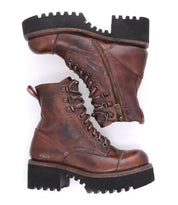 A pair of Bed|Stü Prudence Hi brown leather combat boots featuring thick black chunky platform outsoles, side zippers, and visible stitching, displayed against a white background.