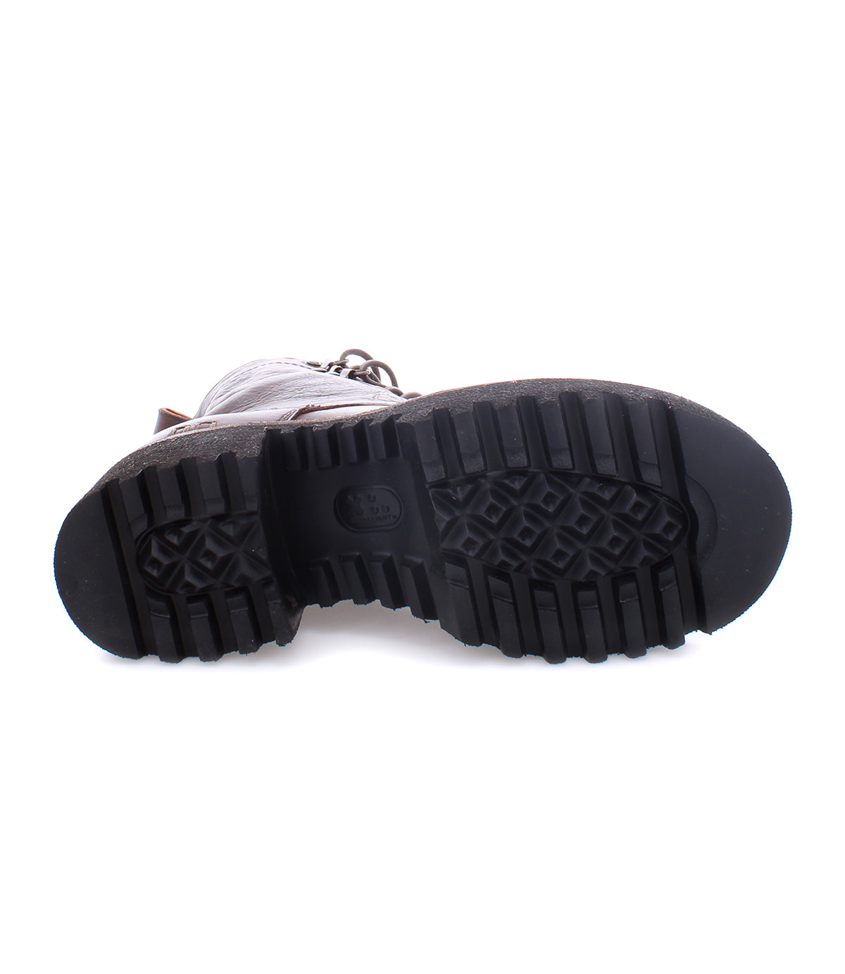 The image shows the bottom view of a single Bed|Stü Prudence Hi black leather combat boot, featuring a thick, rugged tread pattern on its chunky platform outsole.