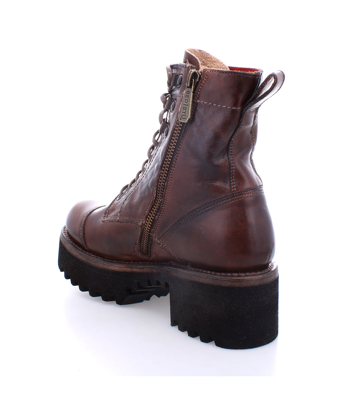 The Bed|Stü Prudence Hi is a brown leather combat boot featuring a side zipper, lace-up front, and thick black treaded sole with a chunky platform outsole, shown from the rear side angle against a white background.