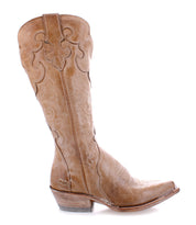 The Bed|Stü Queen boot, shown in profile on a white background, is crafted from light brown vegetable-tanned leather and features decorative stitching with fleur-de-lis details, a pointed toe, and an angled heel.