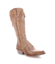 The Bed|Stü Queen is a light brown Western boot, crafted from vegetable-tanned leather with decorative stitching, a pointed toe, stacked heel, and subtle Fleur-de-lis details, shown against a white background.