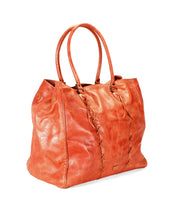 Introducing the Rebekah by Bed|Stü—a large, oversized orange leather tote with double handles and a distinctive stitched design on the front. Handcrafted from premium materials, this spacious tote combines a slightly slouchy silhouette with exceptional style and durability.