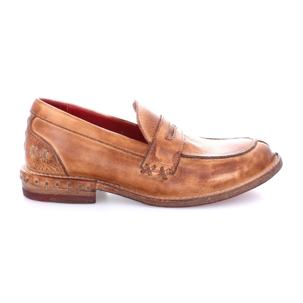 A single light brown Reina penny loafer by Bed|Stü, featuring a Goodyear welt, visible stitching, a gently worn finish, low heel, and classic penny slot on the leather upper, is shown in profile against a white background.