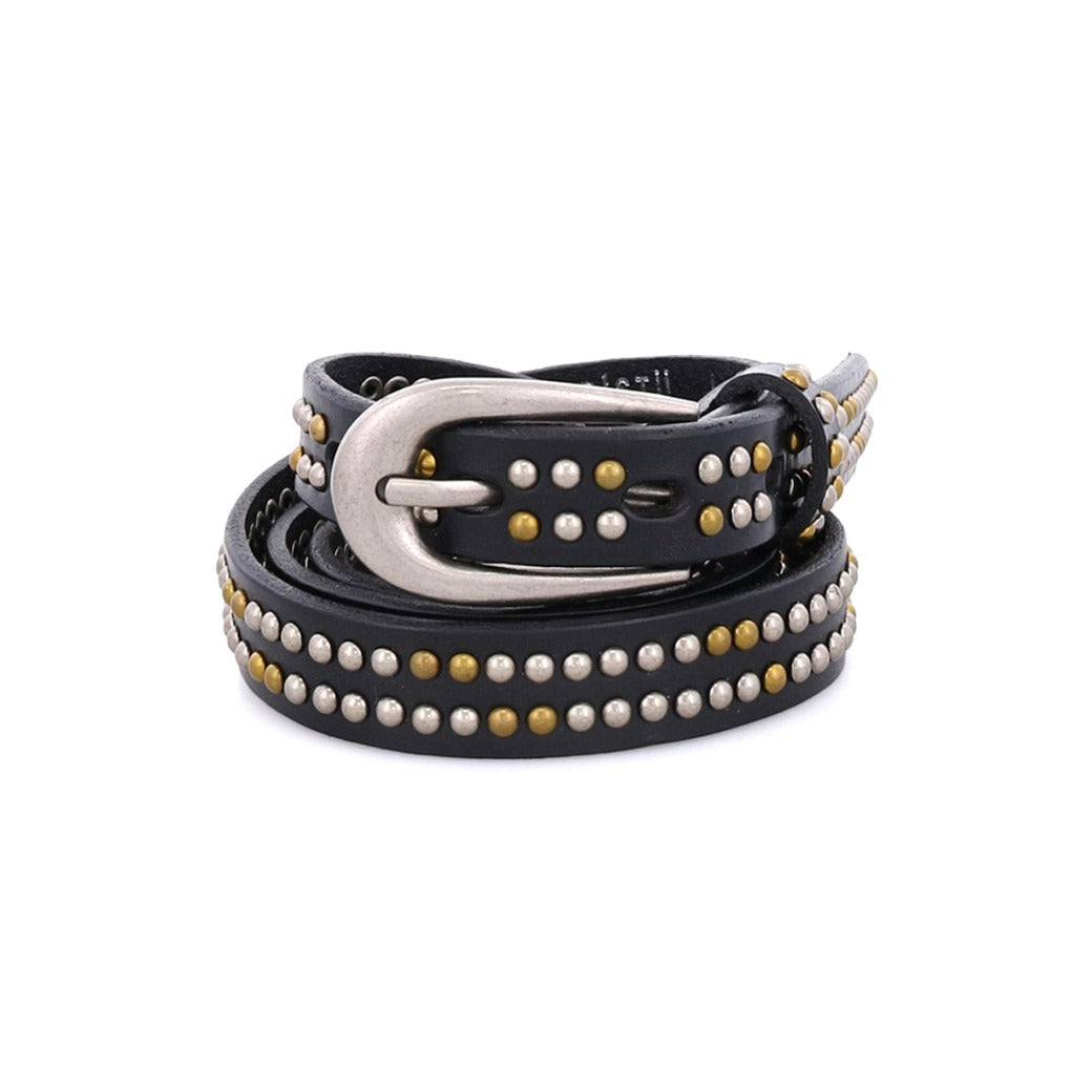 The Rico belt by Bed|Stü is a coiled black leather weekend accessory, adorned with silver and gold metallic studs and finished with a shining silver buckle, displayed against a white background.
