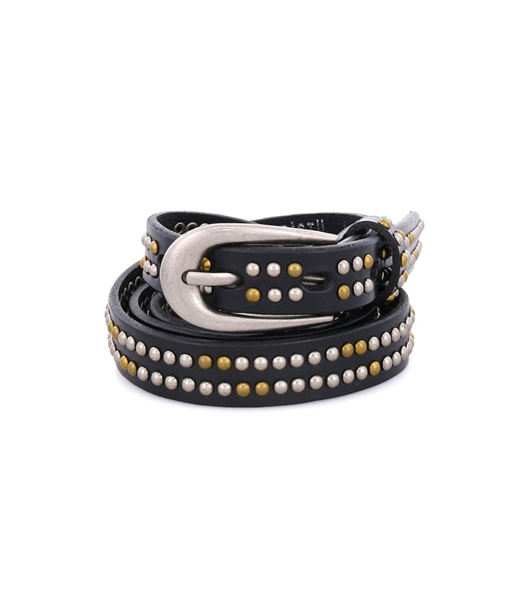 The Rico belt by Bed|Stü is a coiled black leather weekend accessory, adorned with silver and gold metallic studs and finished with a shining silver buckle, displayed against a white background.