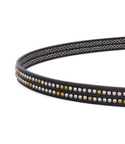 Close-up of the Rico black leather weekend belt by Bed|Stü, adorned with rows of small gold and silver metallic studs and featuring a sleek silver buckle, set against a white background.