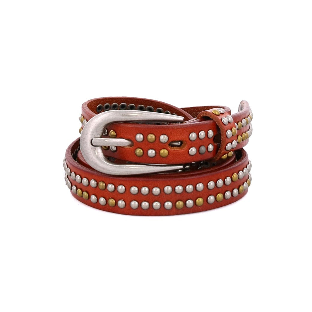 Introducing Rico by Bed|Stü—a brown leather weekend belt adorned with silver and brass metallic studs and finished with a sleek silver buckle, elegantly coiled in a circular shape against a white background.